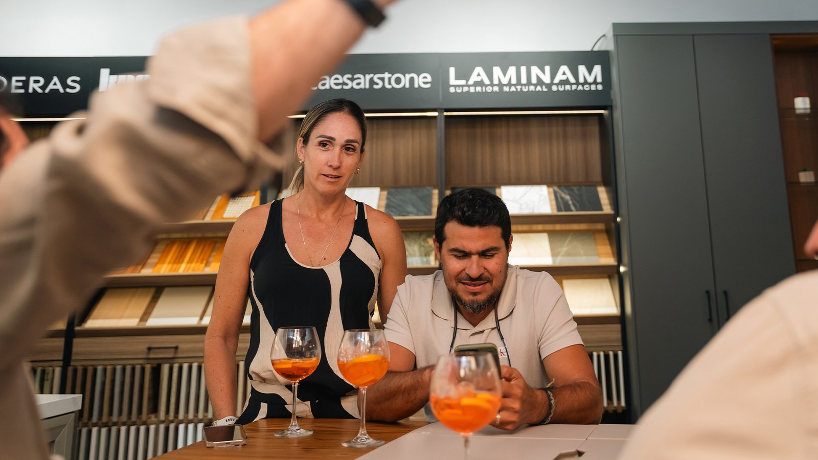 People discovering custom-made furniture at Mobilinea showroom Costa Rica