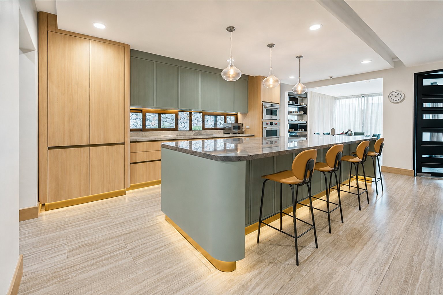 Contemporary custom kitchen in Costa Rica with large island and natural wood cabinetry